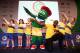 GLASGOW, SCOTLAND - JULY 26: Athlete Usain Bolt of Jamaica (3R) poses with Clyde the mascot and children from Giffnock North Amateur Athletics Club during a photocall at the Main Press Centre (MPC) during day three of the Glasgow 2014 Commonwealth Games