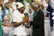 SAN ANTONIO, TX - JUNE 15: NBA Legend Bill Russell gives Kawhi Leonard #2 of the San Antonio Spurs his MVP Trophy against the Miami Heat during Game Five of the 2014 NBA Finals between the Miami Heat and San Antonio Spurs at AT&T Center on June 15, 2014 i