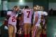 Dec 29, 2013; Phoenix, AZ, USA; San Francisco 49ers quarterback Colin Kaepernick (7) huddles with teammates in the tunnel prior to the game against the Arizona Cardinals at University of Phoenix Stadium. The 49ers defeated the Cardinals 23-20. Mandatory C