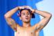 EDINBURGH, SCOTLAND - AUGUST 01: Tom Daley of England warms up prior to competing in the Men's Synchronised 10m Platform Final at Royal Commonwealth Pool during day nine of the Glasgow 2014 Commonwealth Games on August 1, 2014 in Edinburgh, Scotland. (P