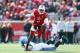 LOUISVILLE, KY - NOVEMBER 23: Teddy Bridgewater #5 of the Louisville Cardinals avoids the tackle of Chase Rome #47 of the Memphis Tigers at Papa John's Cardinal Stadium on November 23, 2013 in Louisville, Kentucky. (Photo by Andy Lyons/Getty Images)