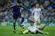MADRID, SPAIN - OCTOBER 02: Christian Bolanos (L) of FC Copenhagen competes for the ball with Raphael Varane (R) of Real Madrid CF during the UEFA Champions League group B match between Real Madrid CF and FC Copenhagen at Estadio Santiago Bernabeu on Octo