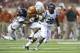 AUSTIN, TX - SEPTEMBER 14: Johnathan Gray #32 of the Texas Longhorns tries to break free against the Mississippi Rebels defense on September 14, 2013 at Darrell K Royal-Texas Memorial Stadium in Austin, Texas. (Photo by Cooper Neill/Getty Images)