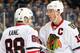 WINNIPEG, MB - NOVEMBER 21: Patrick Kane #88 and Jonathan Toews #19 of the Chicago Blackhawks discuss strategy during first period action against the Winnipeg Jets at the MTS Centre on November 21, 2013 in Winnipeg, Manitoba, Canada. (Photo by Jonathan Ko