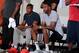 Kyle Lowry and Tracy McGrady watch from the sideline at Adidas Nations.
