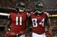 ATLANTA, GA - JANUARY 20: Wide receiver Julio Jones #11 and wide receiver Roddy White #84 of the Atlanta Falcons celebrate after Jones catches a 20-yard touchdown catch in the second quarter against the San Francisco 49ers in the NFC Championship game at