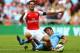 LONDON, ENGLAND - AUGUST 10: Mikel Arteta of Arsenal clashes with David Silva of Manchester City during the FA Community Shield match between Manchester City and Arsenal at Wembley Stadium on August 10, 2014 in London, England. (Photo by Clive Mason/Gett