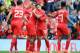 LIVERPOOL, ENGLAND - AUGUST 10: Daniel Sturridge (C) of Liverpool celebrates with team-mate Philippe Coutinho after he scores the first goal of the game for his side during the Pre Season Friendly match between Liverpool and Borussia Dortmund at Anfield