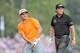 Aug 10, 2014; Louisville, KY, USA; PGA golfer Rickie Fowler watches his tee shot on the 5th tee along with playing partner Phil Mickelson during the final round of the 2014 PGA Championship golf tournament at Valhalla Golf Club. Mandatory Credit: Thomas J