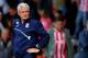 BURTON-UPON-TRENT, ENGLAND - AUGUST 2: Manager Mark Hughes of Stoke watches on during the Pre Season Friendly match between Burton Albion and Stoke City at the Pirelli Stadium on August 2, 2014 in Burton-upon-Trent, England. (Photo by Paul Thomas/Getty Im