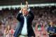 SOUTHAMPTON, ENGLAND - AUGUST 09: Manager Ronald Koeman of Southampton greets the fans before the start of the pre season friendly match between Southampton and Bayer Leverkusen at St Mary's Stadium on August 9, 2014 in Southampton, England. (Photo by Rob