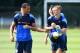 HARLINGTON, ENGLAND - JULY 18: Rio Ferdinand (L) and Jack Collison (R) warm up during a Queens Park Rangers training session on July 18, 2014 in Harlington, England. (Photo by Tom Dulat/Getty Images)