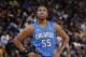 OAKLAND, CA - MARCH 18: E'Twaun Moore #55 of the Orlando Magic while facing the Golden State Warriors on March 18, 2014 at Oracle Arena in Oakland, California. NOTE TO USER: User expressly acknowledges and agrees that, by downloading and or using this pho