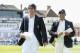 NOTTINGHAM, ENGLAND - JULY 09: England captain Alastair Cook walks out for the toss alongside Mahendra Singh Dhoni of India ahead of day one of 1st Investec Test match between England and India at Trent Bridge on July 9, 2014 in Nottingham, England. (Ph