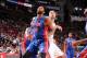 HOUSTON, TX - MARCH 1: Greg Monroe #10 of the Detroit Pistons battles for position against Donatas Motiejunas #20 of the Houston Rockets on March 1, 2014 at the Toyota Center in Houston, Texas. NOTE TO USER: User expressly acknowledges and agrees that, b
