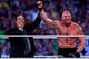 Paul Heyman raises the hand of Brock Lesnar at WrestleMania XXX.