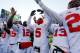 ANN ARBOR, MI - NOVEMBER 30: Quarterback Braxton Miller #5 of the Ohio State Buckeyes celebrates on the field with quarterback Kenny Guiton #13 and quarterback Cardale Jones #12 after defeating the Michigan Wolverines 42-41 in a game at Michigan Stadium