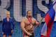 Lana stands by Rusev who proudly waves the Russian flag.