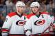 COLUMBUS, OH - MARCH 18: Jordan Staal #11 and Eric Staal #12 of the Carolina Hurricanes talk before a face-off during the second period of a game against the Columbus Blue Jackets on March 18, 2014 at Nationwide Arena in Columbus, Ohio. (Photo by Jamie S