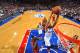 Michael Carter-Williams (No. 1) soars to the rim against James' heat last season.