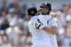 NOTTINGHAM, ENGLAND - JULY 12: James Anderson of England celebrates reaching his half century with Joe Root during day four of 1st Investec Test match between England and India at Trent Bridge on July 12, 2014 in Nottingham, England. (Photo by Gareth Co