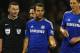 BURNLEY, ENGLAND - AUGUST 18: Referee Michael Oliver speaks to Cesc Fabregas and Nemanja Matic of Chelsea during the Barclays Premier League match between Burnley and Chelsea at Turf Moor on August 18, 2014 in Burnley, England. (Photo by Clive Brunskil
