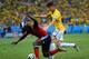 FORTALEZA, BRAZIL - JULY 04: Oscar of Brazil challenges Pablo Armero of Colombia during the 2014 FIFA World Cup Brazil Quarter Final match between Brazil and Colombia at Castelao on July 4, 2014 in Fortaleza, Brazil. (Photo by Jamie McDonald/Getty Image