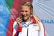SWANSEA, WALES - AUGUST 19: Samantha Kinghorn of Great Britain celebrates winning a gold medal in the Women's 400m - T53 event during day one of the IPC Athletics European Championships at Swansea University Sports Village on August 19, 2014 in Swansea, W