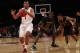 NEW YORK, NY - APRIL 1: Andre Hollins #1 of the Minnesota Golden Gophers drives by Michael Ojo #50 of the Florida State Seminoles during the NIT Championship semifinals at Madison Square Garden on April 1, 2014 in New York City. (Photo by Jeff Zelevans