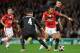 MANCHESTER, UNITED KINGDOM - NOVEMBER 03: Sergei Ignashevich of CSKA Moscow challenges Nani of Manchester United during the UEFA Champions League Group B match between Manchester United and CSKA Moscow at Old Trafford on November 3, 2009 in Manchester, E