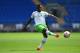 CARDIFF, WALES - AUGUST 02: VFL Wolfburg player Junior Malanda in action during the friendly match between Cardiff City and VFL Wolfsburg at Cardiff City Stadium on August 2, 2014 in Cardiff, Wales. (Photo by Stu Forster/Getty Images)
