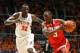 Feb 15, 2014; Champaign, IL, USA; Ohio State Buckeyes guard Shannon Scott (3) drives past Illinois Fighting Illini center Nnanna Egwu (32) at Assembly Hall. Mandatory Credit: Ben Woloszyn-USA TODAY Sports