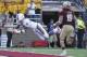 Sep 1, 2012; Chestnut Hill, Massachusetts, USA; Miami Hurricanes wide receiver Malcolm Lewis (9) dives into the end zone to score a touchdown in front of defensive back Sean Sylvia (19) during the fourth quarter at Alumni Stadium. Miami Hurricanes won 41-