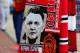 MANCHESTER, ENGLAND - AUGUST 16: View of scarves on sale showing new Manchester United Manager Louis van Gaal prior to the Barclays Premier League match between Manchester United and Swansea City at Old Trafford on August 16, 2014 in Manchester, England.