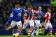 LIVERPOOL, ENGLAND - NOVEMBER 30: Steven Pienaar of Everton shields the ball from Glenn Whelan of Stoke City during the Barclays Premier League match between Everton and Stoke City at Goodison Park on November 30, 2013 in Liverpool, England. (Photo by J