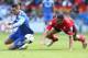 CARDIFF, WALES - MAY 11: Fernando Torres of Chelsea is challenged by Steven Caulker (R) during the Barclays Premier League match between Cardiff City and Chelsea at the Cardiff City Stadium on May 11, 2014 in Cardiff, Wales. (Photo by David Rogers/Getty