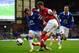 LIVERPOOL, ENGLAND - APRIL 06: Aaron Ramsey of Arsenal competes with Seamus Coleman of Everton during the Barclays Premier League match between Everton and Arsenal at Goodison Park on April 6, 2014 in Liverpool, England. (Photo by Laurence Griffiths/Ge