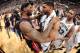 SAN ANTONIO, TX - JUNE 15: LeBron James #6 of the Miami Heat and Tim Duncan #21 of the San Antonio Spurs embrace after the San Antonio Spurs victory in Game Five and winning the 2014 NBA Finals between the Miami Heat and San Antonio Spurs at AT&T Center o