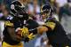 PHILADELPHIA, PA - AUGUST 21: Quarterback Ben Roethlisberger #7 of the Pittburgh Steelers hands the ball off to running back Le'Veon Bell #26 in the first quarter against the Philadelphia Eagles on August 21, 2014 at Lincoln Financial Field in Philadelphi