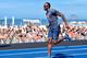 RIO DE JANEIRO, BRAZIL - AUGUST 17: Olympic gold medallist Usain Bolt of Jamaica warms up prior to the 'Mano a Mano' Men's 100m challenge at Copacabana beach on August 17, 2014 in Rio de Janeiro, Brazil. (Photo by Buda Mendes/Getty Images)