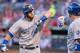Aug 23, 2014; Arlington, TX, USA; Kansas City Royals first baseman Billy Butler (16) congratulates left fielder Alex Gordon (4) after Gordon hits a home run against the Texas Rangers during the first inning at Globe Life Park in Arlington. Mandatory Credi