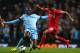 MANCHESTER, ENGLAND - AUGUST 25: Philippe Coutinho of Liverpool competes with Yaya Toure of Manchester City during the Barclays Premier League match between Manchester City and Liverpool at the Etihad Stadium on August 25, 2014 in Manchester, England. (
