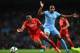 MANCHESTER, ENGLAND - AUGUST 25: Raheem Sterling of Liverpool is challenged by Fernando Reges of Manchester City during the Barclays Premier League match between Manchester City and Liverpool at the Etihad Stadium on August 25, 2014 in Manchester, Englan