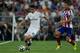 MADRID, SPAIN - AUGUST 19: James Rodriguez (L) of Real Madrid CF competes for the ball with Gabi Fernandez (R) of Atletico de Madrid during the Supercopa first leg match between Real Madrid and Club Atletico de Madrid at Estadio Santiago Bernabeu on Augus