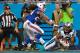 CHARLOTTE, NC - AUGUST 08: Kelvin Benjamin #13 of the Carolina Panthers makes a touchdown catch as Stephon Gilmore #24 of the Buffalo Bills defends during their game at Bank of America Stadium on August 8, 2014 in Charlotte, North Carolina. (Photo by Gr