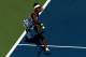 NEW YORK, NY - AUGUST 25: Venus Williams of the United States returns a shot against Kimiko Date-Krumm of Japan during her women's singles first round match on Day One of the 2014 US Open at the USTA Billie Jean King National Tennis Center on August 25,