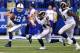 INDIANAPOLIS, IN - NOVEMBER 10: Andrew Luck #12 of the Indianapolis Colts scrambles out of the pocket as Robert Quinn #94 and Michael Brockers #90 of the St. Louis Rams pursue at Lucas Oil Stadium on November 10, 2013 in Indianapolis, Indiana. St Louis de