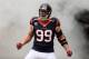 HOUSTON, TX - DECEMBER 01: J.J. Watt #99 of Houston Texans enters the field before the game against the New England Patriots at Reliant Stadium on December 1, 2013 in Houston, Texas. (Photo by Scott Halleran/Getty Images)