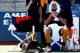 NEW YORK, NY - AUGUST 27: Feliciano Lopez of Spain sits down during a break in play against Ivan Dodig of Croatia during their men's singles first round match on Day Three of the 2014 US Open at the USTA Billie Jean King National Tennis Center on August