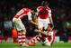 LONDON, ENGLAND - AUGUST 27: Alexis Sanchez (C) of Arsenal celebrates with team mate Nacho Monreal (R) of Arsenal and Mathieu Flamini (L) of Arsenal at the end of the UEFA Champions League Qualifier 2nd leg match between Arsenal and Besiktas at the Emira